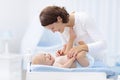 Mother and baby on changing table Royalty Free Stock Photo