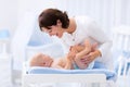 Mother and baby on changing table Royalty Free Stock Photo