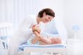 Mother and baby on changing table Royalty Free Stock Photo