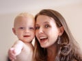 Mother, baby and closeup portrait of happy faces of young family or picture of mom, excited kid and fun memory together Royalty Free Stock Photo