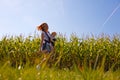 Mother with baby on the corn field Royalty Free Stock Photo