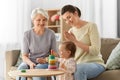 Mother, baby daughter and granny playing at home Royalty Free Stock Photo