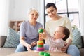 Mother, baby daughter and granny playing at home Royalty Free Stock Photo