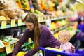 Mother and baby daughter in supermarket Royalty Free Stock Photo