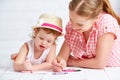 Mother and baby daughter together paint Royalty Free Stock Photo