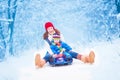 Mother and baby enjoying a sleigh ride Royalty Free Stock Photo