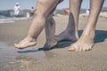 Mother and baby feet walking on sand beach Royalty Free Stock Photo