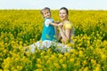 Mother with baby on field Royalty Free Stock Photo