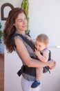 Mother with baby in frontal rucksack Royalty Free Stock Photo