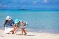 Mother and baby girl drawing on sandy beach Royalty Free Stock Photo