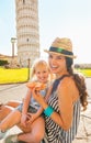 Mother and baby girl eating pizza in pisa Royalty Free Stock Photo