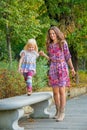 Mother and baby girl having fun time in city park Royalty Free Stock Photo