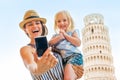 Mother and baby girl making selfie in pisa Royalty Free Stock Photo