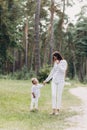 Mother with baby girl outdoors. Happy family on summer walk Mother and daughter walking in the Park and enjoying the beautiful Royalty Free Stock Photo
