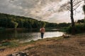 Mother and baby girl sitting near lake. Local travel. New normal vacation. Mother`s day Royalty Free Stock Photo