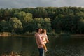 Mother and baby girl sitting near lake. Local travel. New normal vacation. Mother`s day Royalty Free Stock Photo