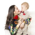 Mother and Baby Gives Flower Bouquet Gift, Happy Mom and Son Boy Royalty Free Stock Photo