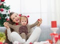 Mother and baby having fun time on Christmas Royalty Free Stock Photo