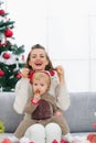 Mother and baby having fun time on Christmas Royalty Free Stock Photo