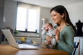 Mother with baby having video call online, conversation with relatives, communicating with friends