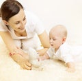 Mother and Baby, Kid Raising Head, Family Playing Toy Bear Royalty Free Stock Photo