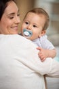 mother and baby kissing laughing and hugging