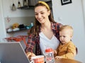 mother baby laptop computer child woman working business parent mom family Royalty Free Stock Photo