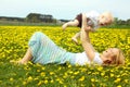 Mother and Baby Laughing in Dandelions Royalty Free Stock Photo