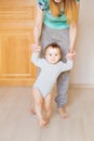 Mother and baby legs. First steps. Royalty Free Stock Photo