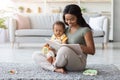 Mother Baby Leisure. Black Mom Reading Book To Toddler Son At Home Royalty Free Stock Photo