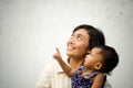 Mother and baby looking up and pointing Royalty Free Stock Photo