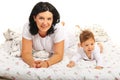 Mother and baby lying bed together Royalty Free Stock Photo