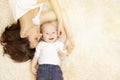 Mother And Baby Lying On Carpet, Happy Family Portrait, Kid Boy