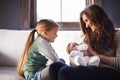 Mother, baby and milk bottle with child in a family home with love, support and care together. Smile, relax and feeding Royalty Free Stock Photo