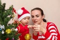 Mother with baby near the Christmas tree Royalty Free Stock Photo