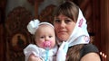 Mother with baby in orthodox church