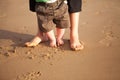 Mother and baby playing on the beach Royalty Free Stock Photo