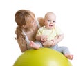 Mother and baby playing with fitness ball Royalty Free Stock Photo