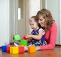 Mother and baby plays with toys Royalty Free Stock Photo