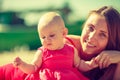 Mother and baby posing in summeral clothing