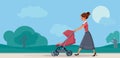 Mother with Baby in Pram Walking in the Park Royalty Free Stock Photo