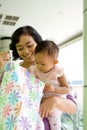 Mother and baby with shopping bag Royalty Free Stock Photo