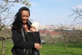 Mother with baby in sling on Petrin hill in Prague