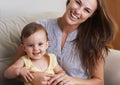 Mother, baby and smile in portrait at home, love and together for bonding in childhood. Mommy, daughter and support for Royalty Free Stock Photo