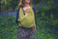 Mother with baby standing in meadow of bluebells Royalty Free Stock Photo