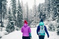 Mother with baby stroller enjoying motherhood in winter forest Royalty Free Stock Photo