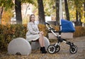 Mother with baby stroller for a newborn