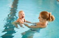 Mother and baby swim in pool Royalty Free Stock Photo