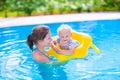 Mother and baby in swimming pool Royalty Free Stock Photo