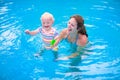 Mother and baby in swimming pool Royalty Free Stock Photo